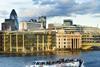 M.V. Millennium of London is seen passing through the City of London.