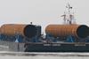 Substantial volumes of steel go into the construction of offshore wind farms, such as these monopole foundations delivered to the UK Port of Ramsgate for the Thanet Offshore Wind Farm. Photo by Peter Barker.