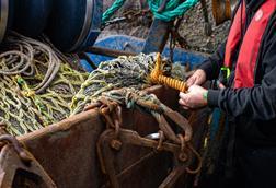 Fisherman mending a net