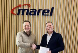 Representatives from Marel and Laxey celebrate a new deal to supply processing equipment for a land-based salmon faciliy