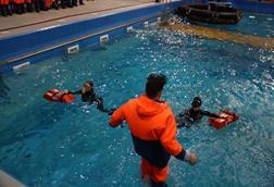 Fishermen being trained on survival skills in a purpose-built pool