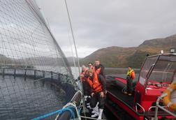 Tour guests visited a MOWI salmon farm on a loch
