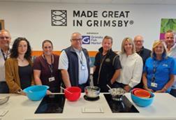 Trustees of the Horizon Youth Group welcome members of New England Seafood International and Made in Grimsby