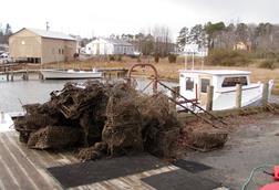 Derelict crab traps are offloaded for disposal after being retrieved from Chesapeake Bay 