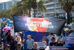 People marching to save the oceans from overfishing and climate change