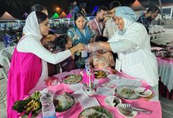 The photo shows attendees at the Matsya Mela meeting