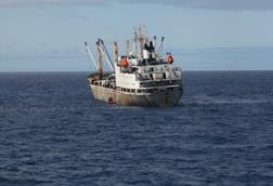 The image shows an IUI fishing vessel taken by the U.S. government