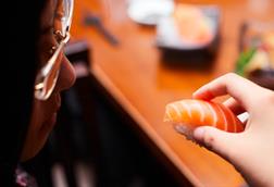 A picture of Norwegian salmon being consumed as sushi