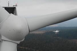 The image shows a drone inspection of a Vattenfall wind turbine