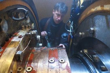 Hydrex diver or technician working inside flexible mobdock