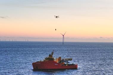 The image shows the drones delivering equipment to a turbine at Hollandse Kust Noord
