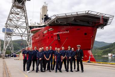 The image shows the newly delivered Grampian Eagle with its crew at the quayside