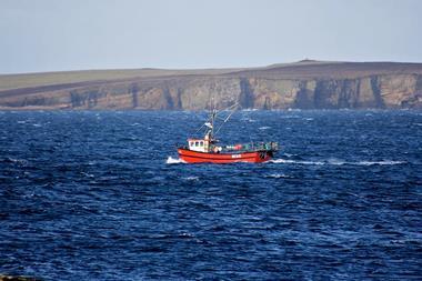 A creel boat on the water in Orkney