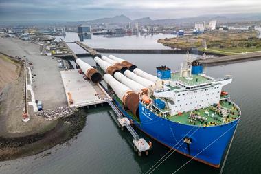 The picture shows the eight massive monopiles arriving via heavy transport vessel at the new deep-water Charles Hammond Berth