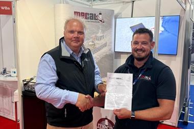 Zero USV Matthew Ratsey receives the certificate from Owen Preece, from MECAL