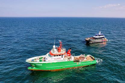 The image shows The image shows the NR Rebellion hybrid Typhoon Class CTV and OEG’s support vessel Tess on the water