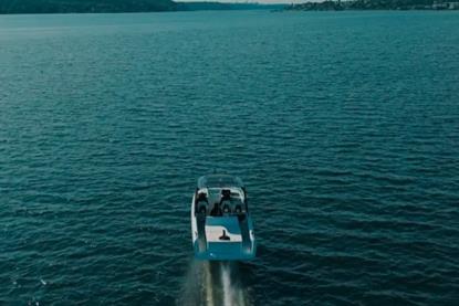 The picture shows the Candela P-12 electric ferry in the water