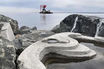 The image shows tide pools integrated into the rock breakwaters