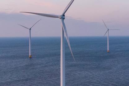 The image shows offshore wind turbines