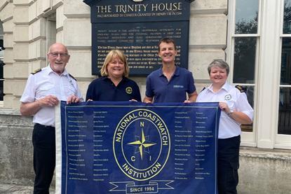 The-anniversary-flag-is-now-at-Trinity-House.-L-R-David-Crozier-NCIs-CEO-Nicola-King-NCI-Filey-Ian-Clarke-Sirius-Insight-Gillian-Woodcock-NCI-Filey.-Credit-Dav