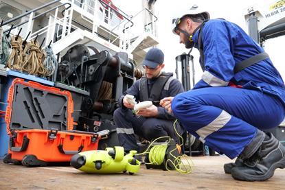 Ned Marine technicians inspect drones offshore