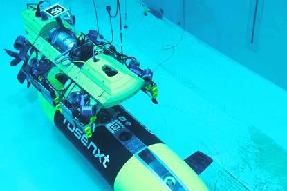 The image shows a Rosenxt AUV under water