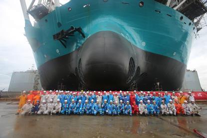The image shows the build crew in from of the newly launched Norse Energi at the yard