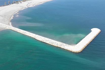 Breakwater jutting out into the sea at Jupiter-Neptun beach in Constanta, Romania