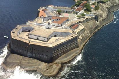 The image shows an overhead shot of the Santa Cruz Lighthouse, located on Santa Cruz Fortress at Guanabara Bay, Brazil