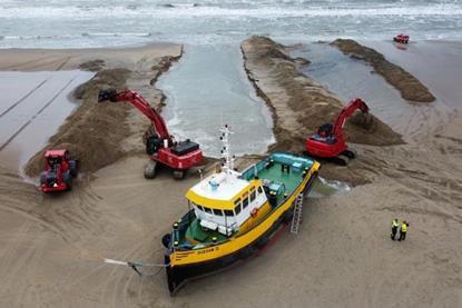 A channel had to be dug to return the stranded tug to the sea  (Koole Contractors)