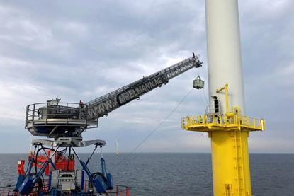 The Ampelmann A-hoist lifting cargo to an offshore wind turbine in the North Sea