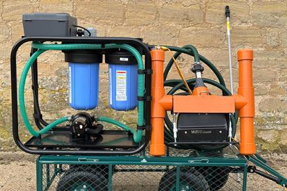 The image shows the Wavecleaner VAC on a trolley