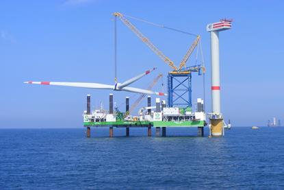 The image shows 'Buzzard' (right) engaged in offshore wind projects