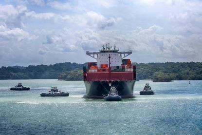 Container ship and tugs near the Panama Canal