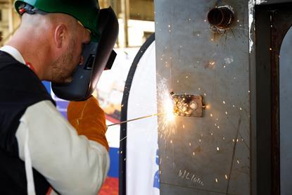 Ceremonial welding of two coins to the keel
