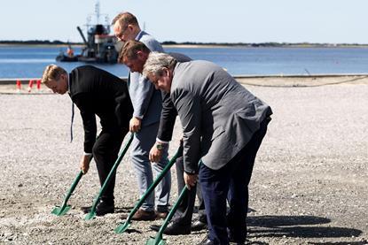 The image shows Thomas Danielson and port executives taking shovels to the ground at Esbjerg