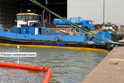 Pollution booms deployed around the damaged tug (MAIB)