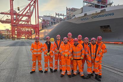 A picture of a group of PPG Apprentices dressed in orange uniforms on the quayside