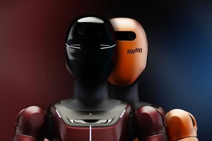 image of two robots, one with a welding mask