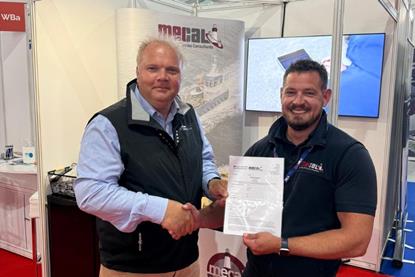 Zero USV Matthew Ratsey receives the certificate from Owen Preece, from MECAL