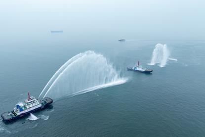 The image shows the Qing Dian Tuo 1 on the water