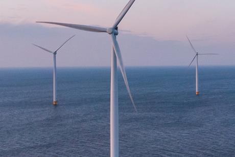 The image shows offshore wind turbines