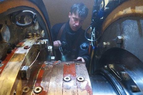 Hydrex diver or technician working inside flexible mobdock