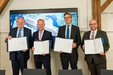 Four members of the HPA showcasing an expansion agreement for Waltershofer Haven