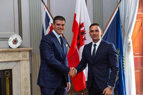 The photo shows John A. Bassadone, founder and CEO of Peninsula, with Aaron Lopez, head of the Maritime Academy University of Gibraltar.