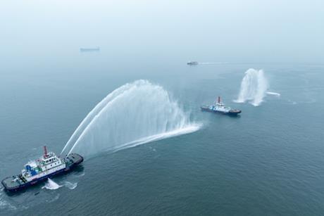 The image shows the Qing Dian Tuo 1 on the water