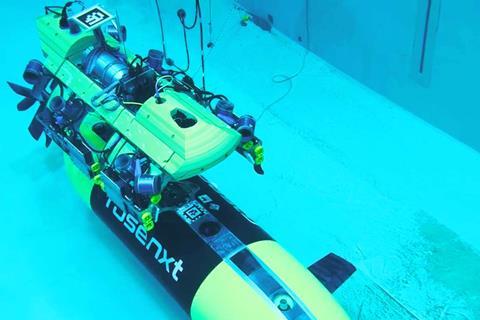 The image shows a Rosenxt AUV under water