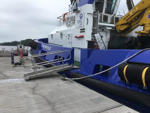 Tug 'Strathfoyle' makes use of the 60m long by 4m wide breakwater