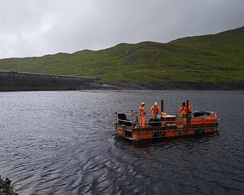 ScaffFloat floating work platform surveying onsite next to the operational dam