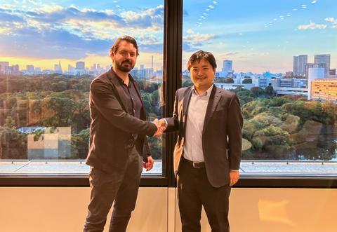 Simon Miller, chief revenue officer at Rovco, clinches the deal with Nobuyuki Takagi, HOM managing director